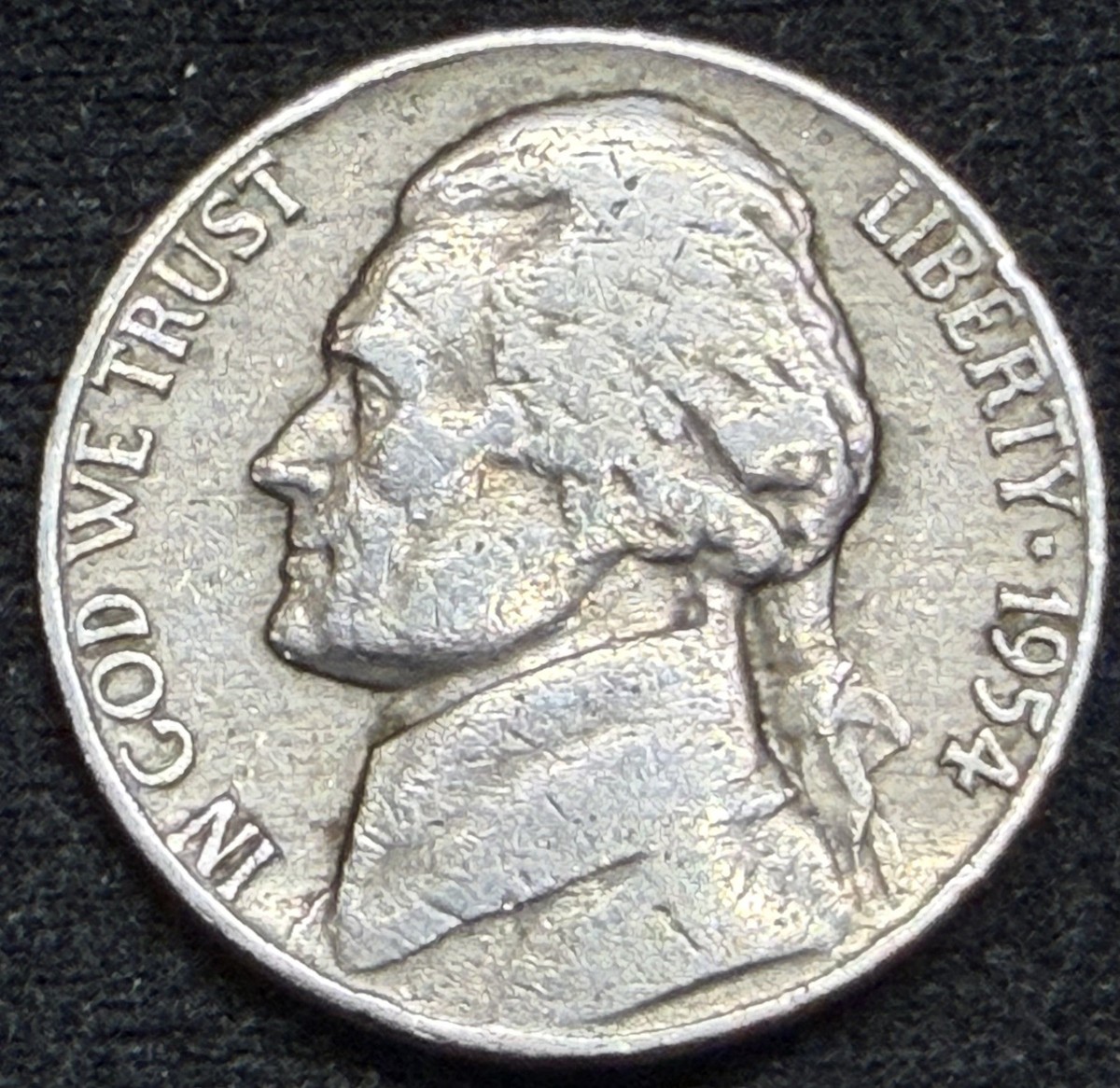 Close-up of 1954-D Jefferson Nickel mint mark area showing Repunched Mint Mark (RPM) with secondary D impression visible