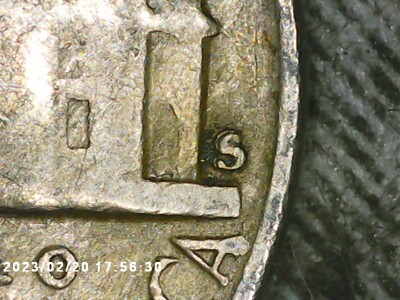 Close-up of 1954-S Jefferson Nickel mint mark showing Repunched Mint Mark variety with secondary S impression